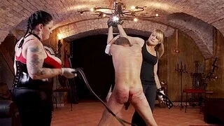 Lady Yultsi enjoys while spanking hard her lover's ass close to a whip